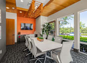 Thumbnail 3 of 12 - A conference room with a long table and chairs.