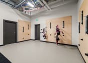 Thumbnail 27 of 27 - a white room with two wooden doors and bikes on the wall