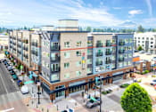 Thumbnail 1 of 20 - an aerial view of an apartment building on a city street