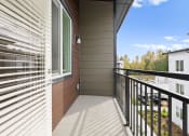 Thumbnail 10 of 27 - the balcony of a home with white blinds on the side of a house