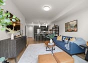 Thumbnail 1 of 27 - a living room with a blue couch and a table