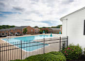 Thumbnail 4 of 31 - A black fence surrounds a small pool.