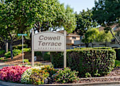 Thumbnail 3 of 22 - a sign for covenant terrace apartments in front of plants and trees at Cowell Terrace Apartments, Concord, 94518