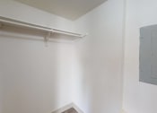Thumbnail 12 of 60 - an empty room with a white wall and a white shelf on the wall