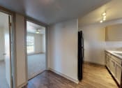 Thumbnail 18 of 60 - a kitchen and living room with a sink and a refrigerator