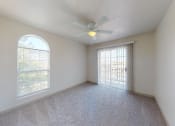 Thumbnail 22 of 60 - a living room with a ceiling fan and a window