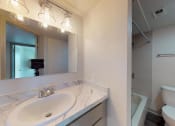 Thumbnail 20 of 60 - a bathroom with a sink, vanity, tub and toilet