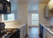 Thumbnail 31 of 60 - a kitchen with a sink and a counter top