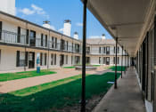 Thumbnail 54 of 60 - a view of a courtyard in a building at an apartment complex