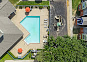 Thumbnail 1 of 23 - A swimming pool with a slide and a hot tub.