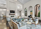 Thumbnail 8 of 27 - A living room with a grey carpet and furniture.