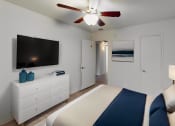 Thumbnail 10 of 16 - a bedroom with a bed and a ceiling fan