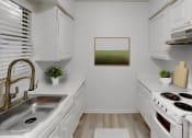 Thumbnail 8 of 16 - a kitchen with white cabinets and white appliances and a sink