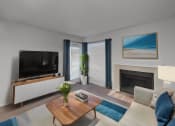 Thumbnail 10 of 22 - a living room with a couch and a tv and a fireplace
