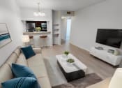 Thumbnail 1 of 22 - a living room with a couch and a television