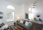 Thumbnail 6 of 13 - a living room with a couch and a coffee table