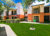Thumbnail 13 of 22 - Building exterior with grill in greenspace