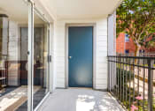 Thumbnail 20 of 20 - the front door of a white house with a blue door