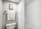 Thumbnail 17 of 20 - a bathroom with a toilet and a shower