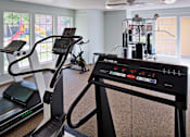 Thumbnail 21 of 22 - Fitness center with workout equipment