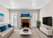 Thumbnail 6 of 16 - a living room with a couch and a coffee table