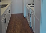 Thumbnail 23 of 33 - a kitchen with white cabinets and white appliances and a white refrigerator