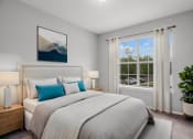 Thumbnail 3 of 13 - furnished bedroom with white bedding and a window with a plant
