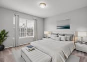 Thumbnail 7 of 13 - a white bedroom with a large bed and a window