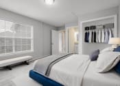 Thumbnail 4 of 13 - a bedroom with a bed and a window and a closet