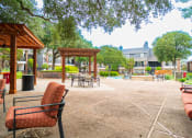 Thumbnail 37 of 37 - a large patio with chairs and umbrellas