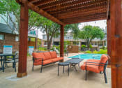 Thumbnail 27 of 37 - our apartments have a pool and a patio with chairs and tables