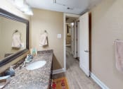 Thumbnail 6 of 19 - a bathroom with a sink and a mirror in a hotel room