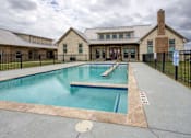 Thumbnail 5 of 6 - A large house with a pool in front.