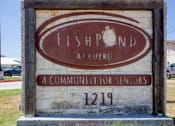 Thumbnail 7 of 9 - A sign for Fishpond AI Lueko, a community for seniors, is displayed.