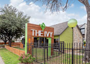 Thumbnail 2 of 18 - A green and brown building with THEY on the front.