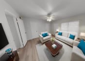 Thumbnail 9 of 16 - a living room with couches and a coffee table