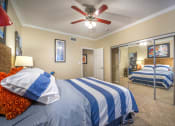 Thumbnail 24 of 25 - a bedroom with two beds and a ceiling fan