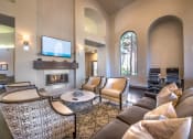 Thumbnail 20 of 25 - a living room with couches and chairs and a fireplace