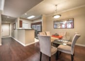 Thumbnail 2 of 25 - a dining room and kitchen with a table and chairs