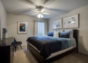 Thumbnail 13 of 23 - our master bedroom has a large bed and a ceiling fan