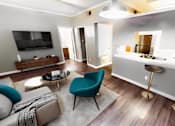 Thumbnail 1 of 13 - a living room and kitchen with a couch and a chair