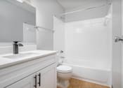 Thumbnail 17 of 35 - a bathroom with a sink toilet and shower