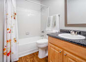 Thumbnail 22 of 35 - a bathroom with a sink toilet and shower