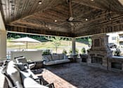 Thumbnail 14 of 26 - Outdoor patio with fireplace