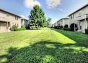Thumbnail 1 of 11 - Grass courtyard between buildings at Waters Mark Apartment Homes, Gulfport, Mississippi