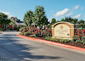 Thumbnail 11 of 38 - Property Sign at Country Oaks Apartments, San Marcos, TX