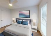 Thumbnail 5 of 23 - a bedroom with a large bed and a ceiling fan