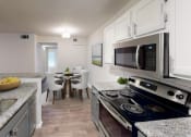Thumbnail 7 of 23 - view of kitchen and dining area at the preserve at greatstone apartments in greatstone