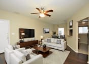 Thumbnail 1 of 8 - a living room with white couches and a coffee table