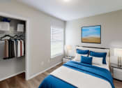 Thumbnail 7 of 20 - a bedroom with a bed and a closet